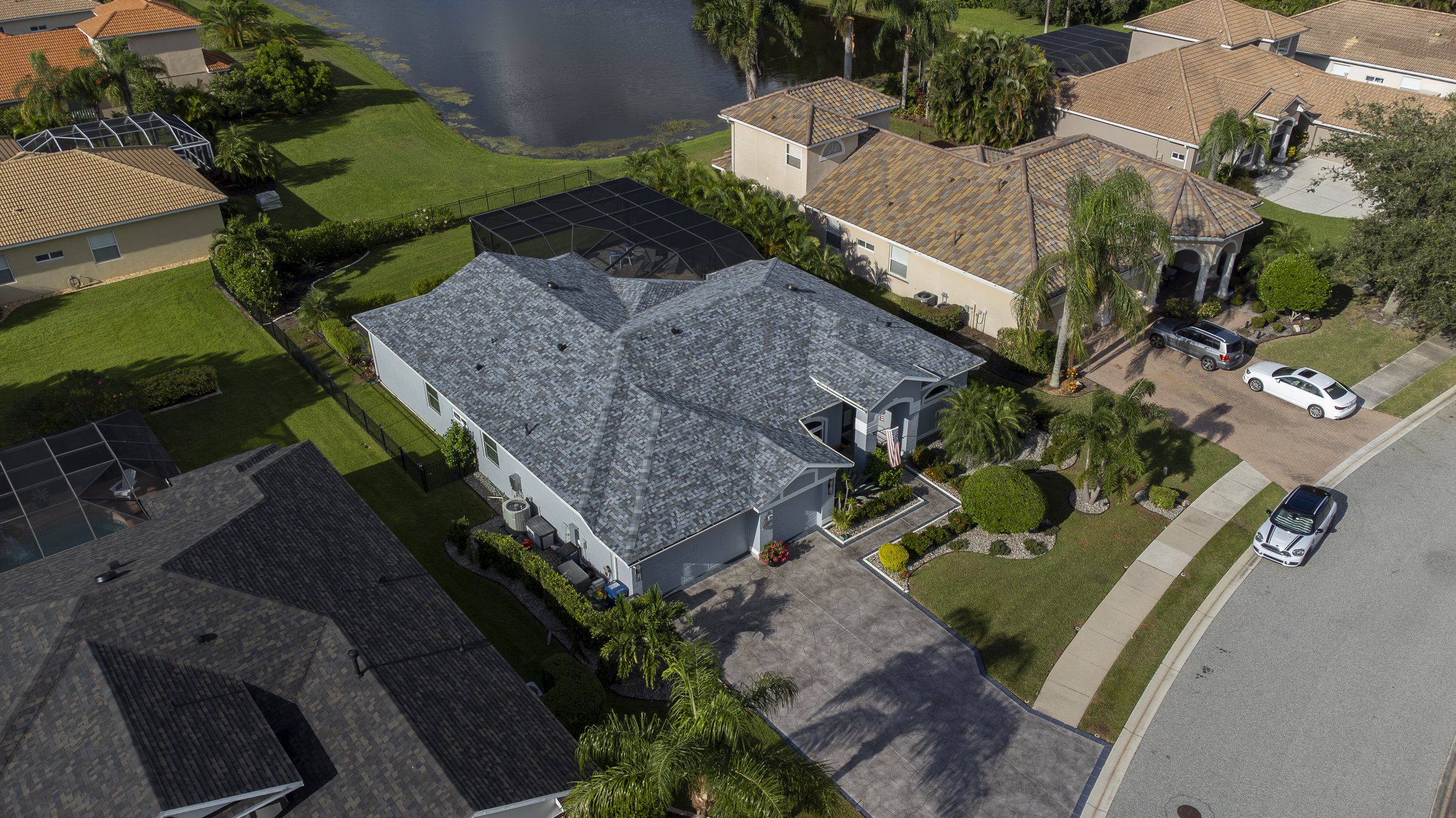 Angled drone aerial of waterfront luxury home