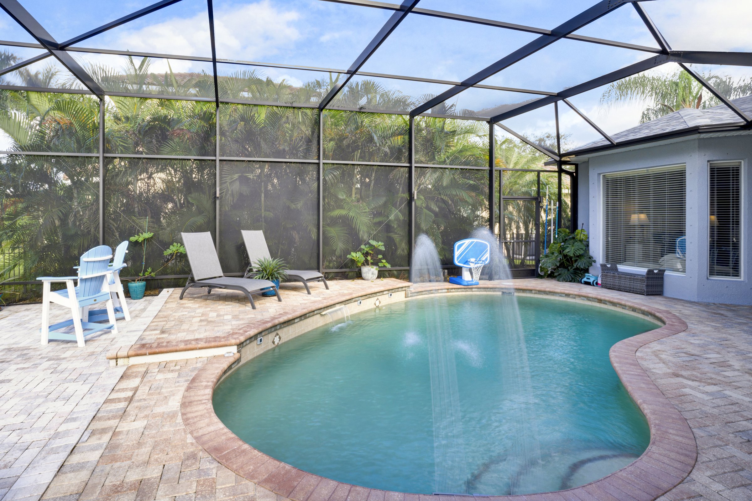 Screened pool with fountains in Sarasota home