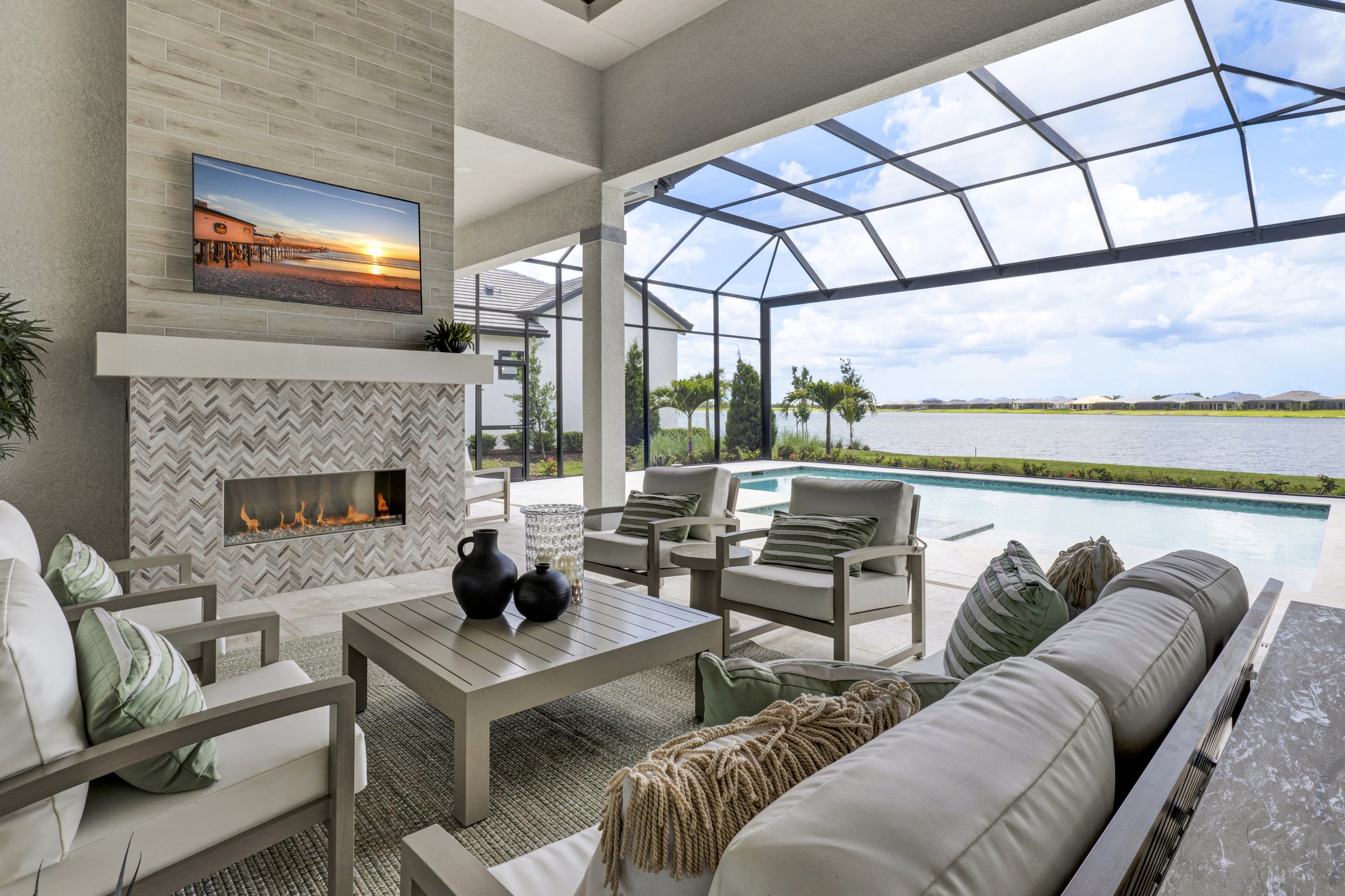 Waterfront lanai with TV and fireplace